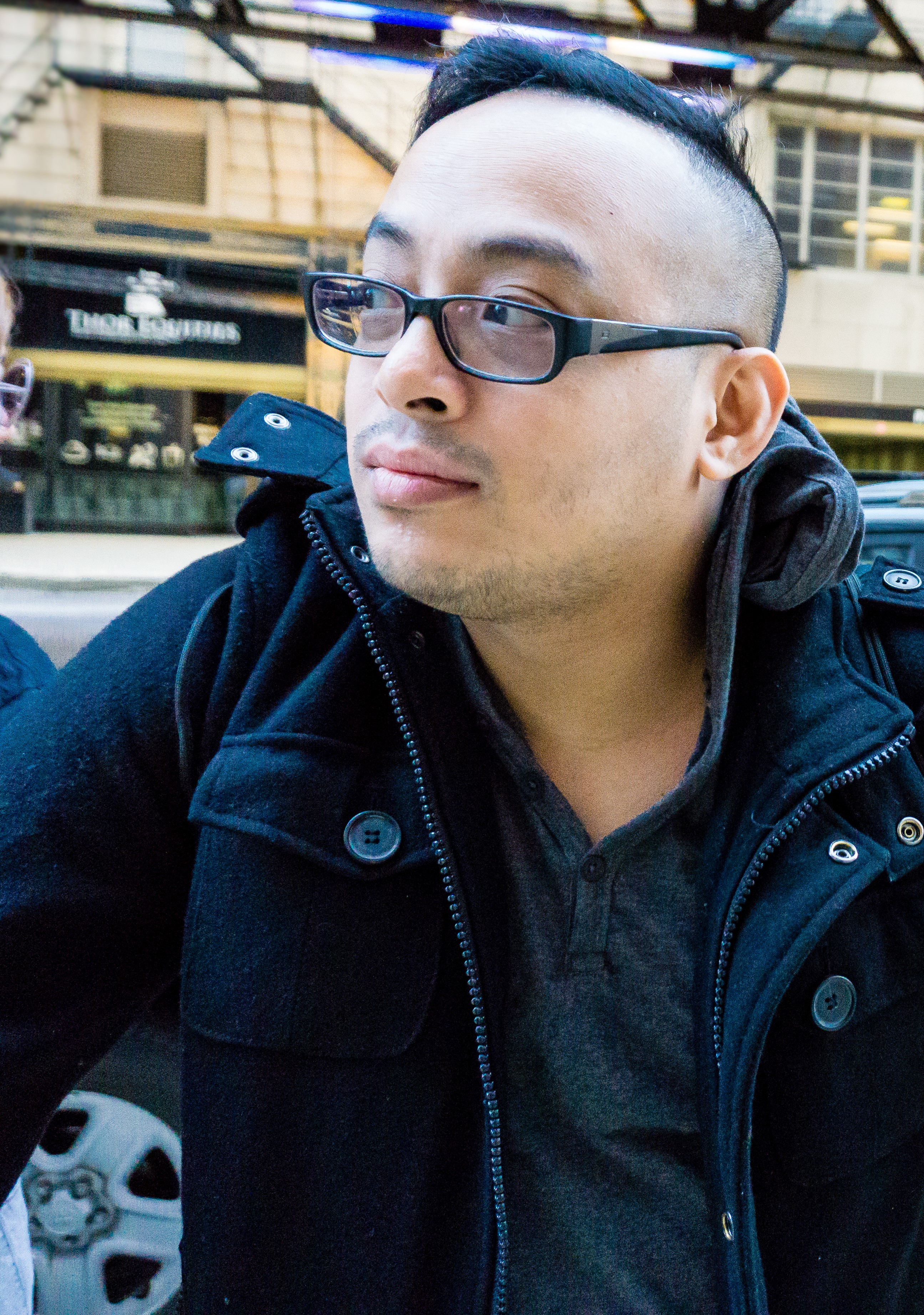 profile pic with glasses and black jacket that is looking in the left
